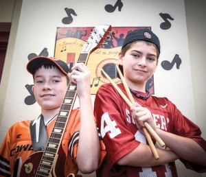 BEDLAM UNITED - Chisholm Trail Middle School seventh graders Bo Faver (left) and Riley Adams will perform at the House of Blues Saturday in Dallas, the same day as the rivalry football game between Okahoma State University and the University of Oklahoma, after which the duo named their band, "Bedlam United" was derived from each family's opposing allegiances in the rivalry. Messenger photo by Joe Duty