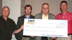 DIAMOND LEVEL GIVERS - Wise Regional Health System was honored as a diamond level donor for contributing at the $5,000 level. Representing the DEF board are (from left) Randy Shrull and Todd Scroggins. WRHS was represented by CEO Steve Summers (center) and Administrative Director of Human Resources Mike McQuiston. Submitted photo