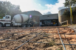 FIXING THE SITUATION - The sidewalk in front of the northeast entrance to Decatur's McCarroll Middle School was replaced this week, and the bricks that were damaged and removed will be replaced, the superintendent says. Messenger photo by Joe Duty