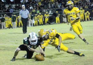 FUMBLE RUMBLE - Boyd's Fino Cordona and Robert Norvell of Paradise scramble for a loose ball after a 'Jacket reverse went awry. Messenger photo by Mack Thweatt