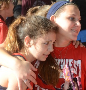 GOOD FINISH - Katherine Chavez gets some help after the race Saturday. Messenger photo by Mack Thweatt