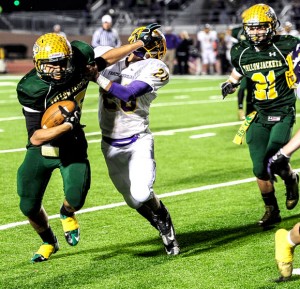 IN YOUR FACE - Fino Cardona brushes away a Farmersville defender in the Boyd victory Friday, Nov. 16. Messenger photo by Joe Duty