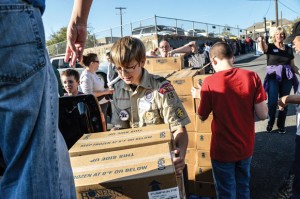 LENDING A HAND - Boy Scout Tommy Tilson, 13, of Boyd helps unload 500 pumpkin pies at the Wise Area Relief Mission Tuesday morning. Messenger photo by Joe Duty