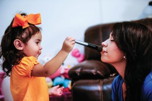 MAMA'S GIRL - After a maternal void led Consuelo Rosales down a harmful path of drug use, she is determined to be the best mother possible to her 2-year-old daughter, Miracle Noelle. The two enjoy reading, praying and playing with makeup together. Messenger photo by Joe Duty