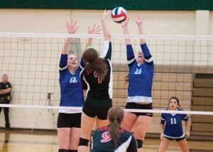NICE BLOCK - Katie Isham and Cooper Martin go up  for the block. Messenger photo by Jimmy Alford