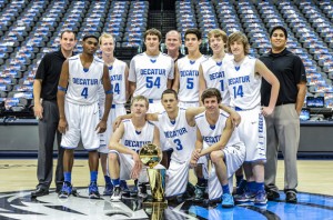 PHOTO WITH GREATNESS - The Eagles pose with the Mavericks' 2011 NBA championship trophy Monday. Messenger photo by Joe Duty