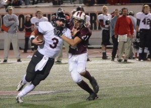 RUNNING AWAY - Bridgeport defensive lineman Tommy Canales tries to bring down Argyle quarterback Brandon Boyzuick during the Friday night playoff game. Messenger photo by Mack Thweatt