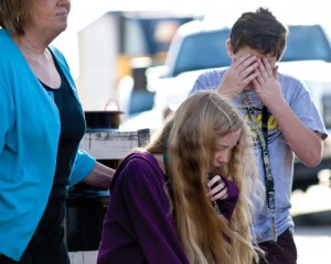 SHOOK UP - A pair of students, Veronica Ellis and Conor Howard, from Chisholm Trail Middle School recover after their school bus was struck from behind at a bus stop in Newark on Farm to Market 718. Messenger photo by Jimmy Alford
