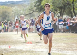 STATE CHAMPIONS - Taylor Clayton closes in on the finish line at the state cross country meet in Round Rock Saturday. The Decatur junior finished third overall and led his team to the state title. Messenger photo by Joe Duty