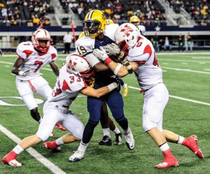 TAKE DOWN - Northwest's Nick Chiofalo and Colton McDonald make the stop Thursday against Arlington Lamar. The Texans season came to an end with a 37-30 loss. Messenger photo by Joe Duty