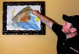 ANGEL'S ARMS - Two weeks before Daniel Barnes drowned in a swimming pool at his grandparents' house, the not yet 3-year-old painted a portrait of an angel scooping a small bundle of a boy out of blue water. Messenger photo by Joe Duty