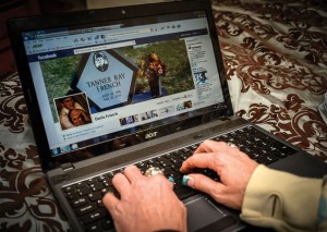 DIGITAL DIARY - Darla French has a portrait of her son's gravestone as the cover photo on her Facebook page. Her son Tanner gave subtle hints about his intentions in the days leading up to his death. Messenger photo by Joe Duty