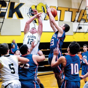 GOING UP - Slidell's Jarrett Tinsman and Alvord's Jordan Locklear fight for the basketball during the second round of the Era Tournament. Messenger photo by Joe Duty