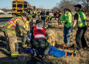 INJURIES - Emergency responders strap several crash victims to backboards just before shipping them to  Wise Regional Health System in Decatur. Messenger photo by Joe Duty
