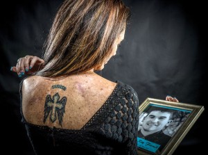 LIVING WITH SUICIDE - Darla French, 45, of Lake Bridgeport, ensured she'd never forget the impact her 19-year-old son Tanner had on her life. She got a tattoo in his memory on her back after he shot and killed himself in February 2011. Messenger photo by Joe Duty