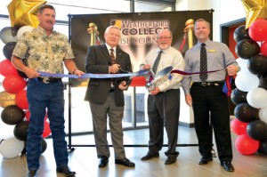 OFFICIALLY OPEN - County Commissioner Kevin Burns (from left), Weatherford College Board Chair Frank Martin, County Judge Bill McElhaney and Weatherford College President Kevin Eaton cut the ribbon at the college's grand opening celebration in September. Messenger photo by Joe Duty