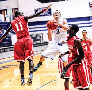 SECOND PLACE - Decatur's Cameron Mize looks for an open shot in the lane during the first round of the Decatur Invitational. Messenger photo by Joe Duty