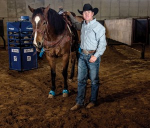 STEP IN THE ARENA - Every year Trevor Brazile, 36, has his Decatur arena modified to match the dimensions found at the Thomas And Mack Center in Las Vegas where he will be competing in the Wrangler National Finals Rodeo, which starts next Thursday. Brazile begins the event ranked first in team roping and all-around. Messenger photo by Joe Duty