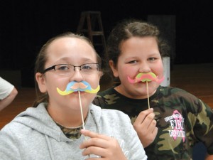 SUPPORTING A CAUSE - Slidell students Cate Zuniga and Camryn Franklin sport colorful mustaches in support of Movember, an effort to raise awareness about prostate cancer. Submitted photo