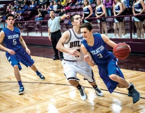BIG WIN - Decatur's Cameron Mize drives baseline against Bridgeport's Alex Samples Friday. The Eagles pulled away for a 64-36 victory. Messenger photo by Joe Duty