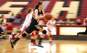 FULL SPEED - Alvord's Marissa Schedcik runs down the floor during the Whataburger Tournament Saturday. Messenger photo by Mack Thweatt