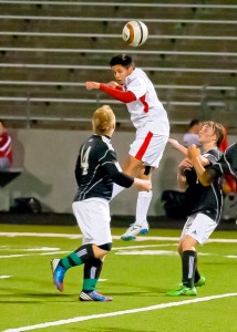 HEADS UP - Marco Rodriguez deflects a punt from the Azle keeper to put the balls back in the Texans control. Messenger photo by Jimmy Alford