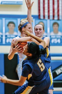 MY BALL - Decatur's Traci Hale protects the ball against two Sanger defenders Friday. The Lady Eagles held on for a 54-43 win. Messenger photo by Joe Duty