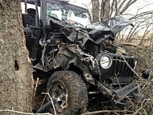 OFF ROAD - Fischer's vehicle was a total loss after it crashed into a stand of trees. Messenger photo by Joe Duty