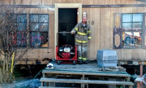 SAVED HOME - A fire that broke out underneath a mobile home Wednesday on Rogers Road in Newark was contained to the undercarriage thanks to the quick response of Newark and Rhome firefighters. The cause of the fire is unknown. Messenger photo by Joe Duty