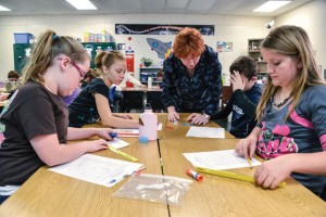 SCOPED OUT - Boyd fifth-grade veteran math and science teacher Nelda Cope said CSCOPE has helped her better sequence lessons. Tuesday morning, students (from left) Lindsay Carroll, Brianna Herring, Dalton Westray and Cortney Clamon practice group work. Messenger photo by Joe Duty