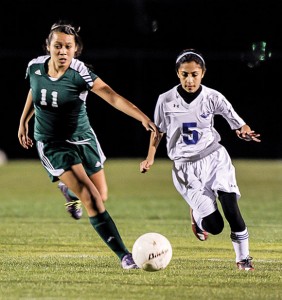 AROUND THE SIDE - Decatur's Paola Palomo tries to run down a Western Hills player. Messenger photo by Joe Duty