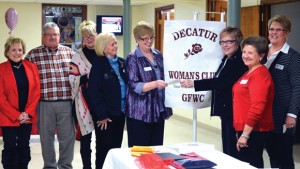 CHECK PRESENTATION - Decatur Woman's Club Treasurer Joyce Ogle presents Pat Slayton, executive director of Wise Hope Shelter and Crisis Center, a $4,000 check. Also on hand for the presentation were (from left) Lynn Long, DWC member and board president of Wise County Domestic Violence Task Force; Decatur Police Chief Rex Hoskins; Susan Anderson, Task Force board member; Sue Russell, Task Force board member and Woman's Club member; Lou Hitt, DWC president; and LaDonna Wren, Tour of Homes benefactor chair. Submitted photo