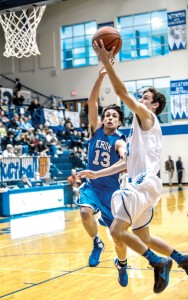 DISTRICT CHAMPS - Taylor Clayton finished a fast break Tuesday against Krum. With the win, the Eagles clinched the district title and will get a bye in the first round of the playoffs. Messenger photo by Joe Duty