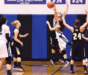 DOMINATING EFFORT - Alvord's Sam Hahn gets the block Friday against Paradise in the District 9-2A playoff for second place. The Lady Bulldogs won 66-47. Messenger photo by Mack Thweatt