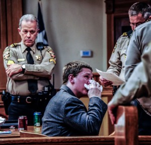 EMOTIONAL PROCEEDINGS - Danny Nalley uses a tissue given to him by a deputy immediately after his punishment was announced Thursday. District Court Bailiff Dick Wood watches Nalley's emotional reaction. Messenger photo by Joe Duty