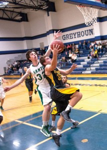 FROM BEHIND - Dylan Hightower goes up for two points with a Santo defender attempting to block. Hightower led both teams' scorers and was a big part in Chico's short-lived comeback Thursday. Messenger photo by Jimmy Alford