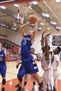 GETTING POSITION - Decatur's Cameron Mize gets inside for a layup against Dallas Roosevelt in their area round playoff game Friday. Messenger photo by Jimmy Alford