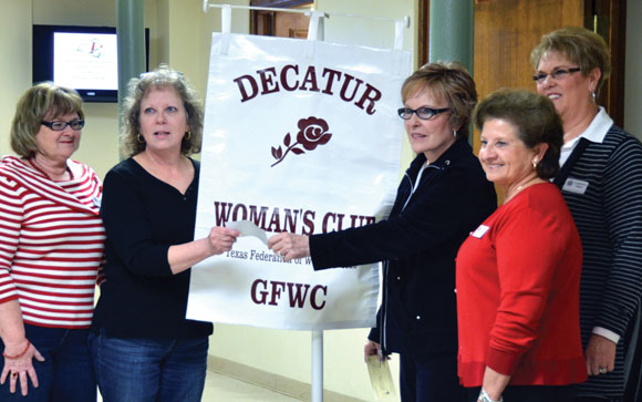 GIVING TO WARM - Decatur Woman's Club Treasurer Joyce Ogle presents WARM Director Ren Ashmore with a check. Also pictured are (left) Sherry Henderson, DWC president-elect; (right, from left) Lou Hitt, DWC president; and LaDonna Wren, Tour of Homes benefactor chair. Submitted photo