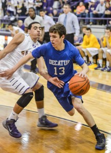 KEEPING PACE - Decatur's Taylor Clayton makes his way to the bucket Tuesday against Sanger. With the win, the Eagles stay tied for first-place in district play. Messenger photo by Joe Duty