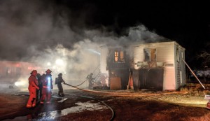 MUTUAL AID - Firefighters from Alvord, Decatur, Chico and Sunset responded to Tuesday's house fire, reported just after 8 p.m. Messenger photo by Joe Duty