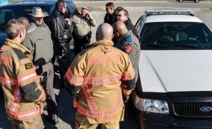 READY FOR ACTION - Emergency responders gather at a the command site near the Devon Energy natural gas processing plant in Bridgeport moments after a bomb threat was reported. Messenger photo by Joe Duty