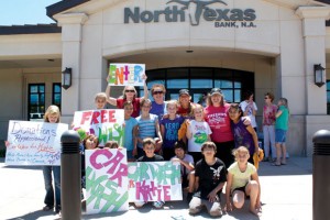 RETURNING THE LOVE - Rann Elementary school fourth graders raised more than $5,000 at a car wash benefitting Stevens in 2009, shortly after her third re-diagnosis. A student-made sign that read, "Kids need her, lets help" best summed up the efforts. Submitted photo