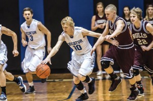 STRIPPED AWAY - Decatur's Austin Givens gets to the loose ball ahead of Bridgeport's Derrick Stanford Tuesday. The Eagles pulled away for the 54-39 victory. Messenger photo by Joe Duty