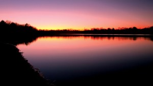 SUNSET OF THE GRASSLANDS - The sun goes down over Cottonwood Lake in the LBJ Grasslands. Get in touch with a rare, precious natural resource in the Messenger's multi-part series on the Grasslands. Explore the outdoors that is almost in your own backyard. Messenger photo by Jimmy Alford