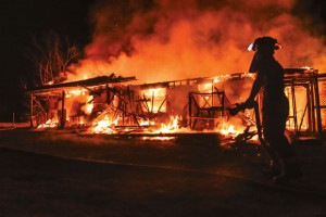 TOTAL LOSS - Despite the best efforts of firefighters from four departments, a blaze consumed a Boyd home early Sunday morning. Messenger photo by Joe Duty