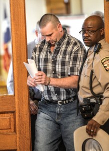 TRYING DAY - Richard Lee Sherman is led out of the courtroom by Deputy Paul Booker Wednesday moments after a jury found Sherman guilty of indecency with a child. Messenger photo by Joe Duty