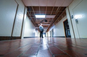 BACK TO THE FUTURE - Decatur ISD Superintendent Rod Townsend shows off some of the planned work at the district's "1939" building. The district plan2s on restoring or preserving as much of the building as possible, including keeping the brick floors in the hallways and removing the dropped ceiling in the entryway to reveal the original ceiling and detail on the walls. Messenger photo by Joe Duty