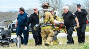 CRITICAL CONDITION - Wise County medics and Decatur firefighters carry suspect Evan S. Ebel, 28, of Colorado, to a waiting ambulance. Ebel was flown from Wise Regional Health System in Decatur to John Peter Smith Hospital in Fort Worth where he was declared brain dead and later deceased following his shoot-out with Wise County law enforcement. Messenger photo by Joe Duty