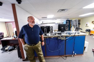 NEEDING MORE ROOM - Decatur ISD Technology Director Troy Bagwell shows off the "shop" area where work is performed on computer equipment. The planned restoration of the "1939" building as a future home to administration offices will allow the technology department to move to the current administration building. Messenger photo by Joe Duty
