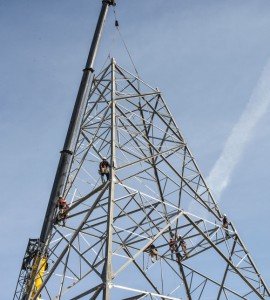 RIDING THE WIND - The towering line being built across north Wise County will carry wind-generated energy from West and Central Texas to the power-hungry Metroplex. It's one of two such lines crossing through the county. Messenger photo by Joe Duty